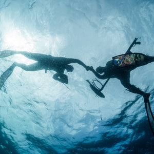 spearfishers fist bump safety course taken by cindy at sea