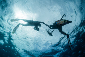 spearfishers fist bump safety course taken by cindy at sea