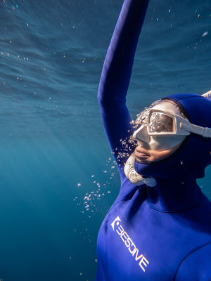 female freediver approaching the surface